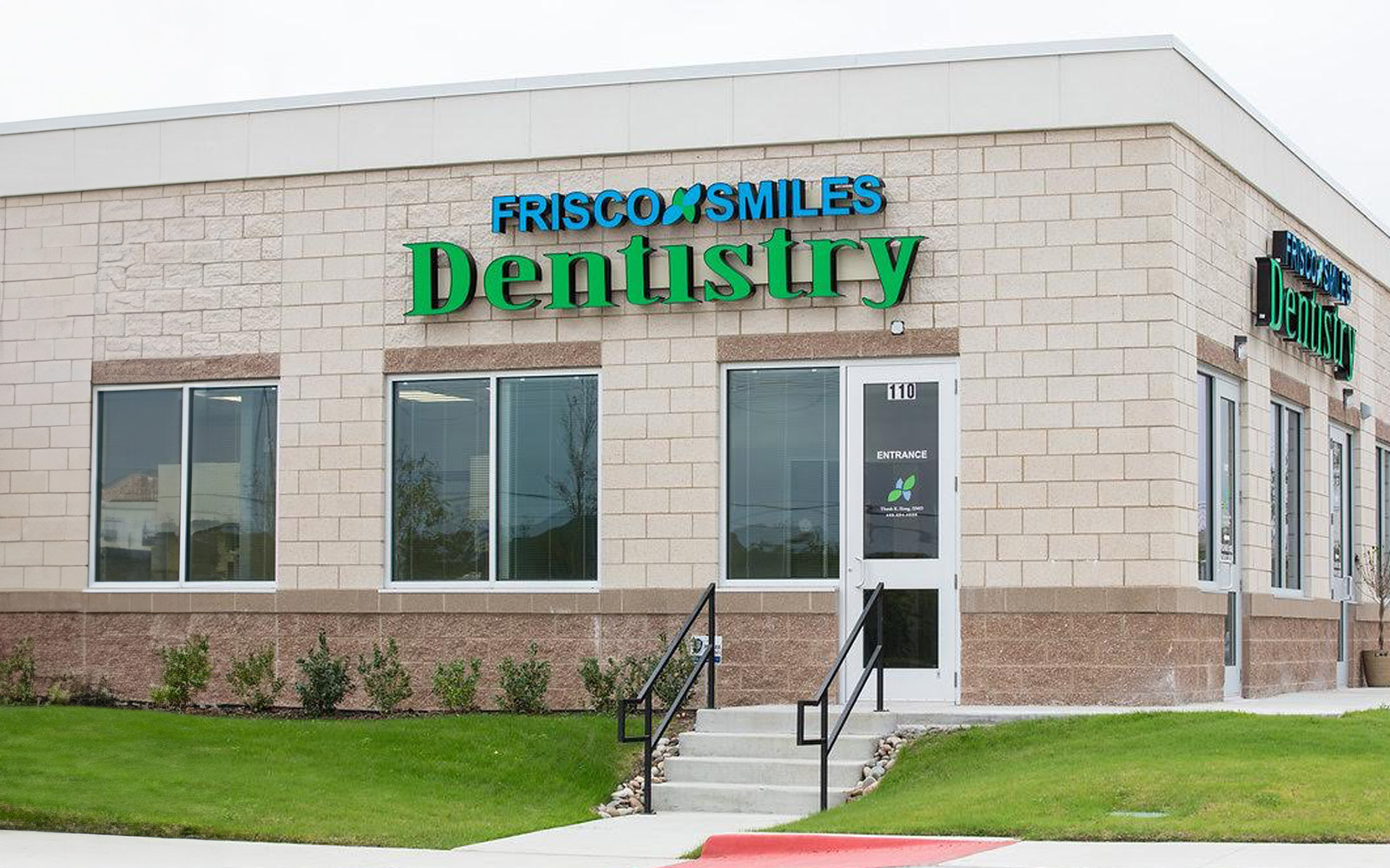 The image shows a dental clinic with a sign reading  Fresco Smiles Dentistry  and a logo indicating it s an FDA-approved facility, located outside during daylight hours.
