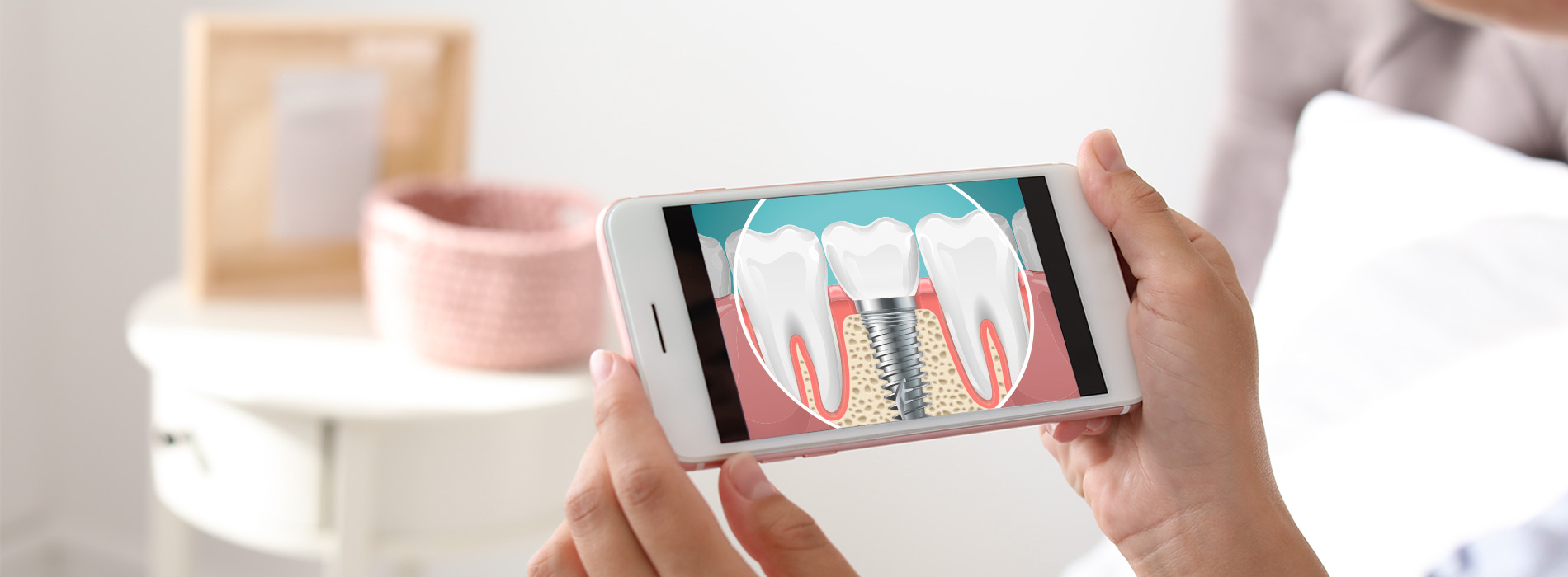 A person holding a smartphone displaying an animated toothbrush brushing teeth with a message about dental care.